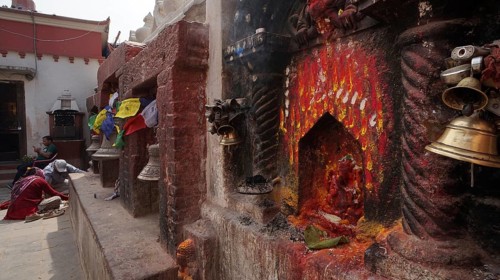 A place of prayer temple wall with religious symbols and devout people in colorful surroundings,