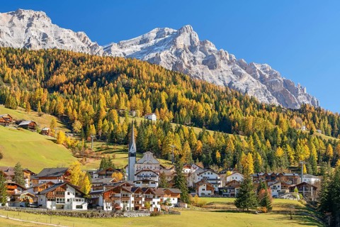 Church of St. Leonhard in Abtei, Alta Badia, Heiligkreuzkofel, autumn, larches, blue sky,