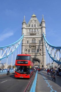 Red double-decker bus on Tower Bridge, London, England, United Kingdom