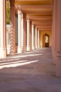 Long colonnade with openwork play of light from the sun in warm pink, Mosque, Schwetzingen Palace