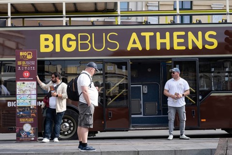 Athens, Greece. April 24th 2025. Tourists and touts at The Big Bus Hop on Hop off discover and