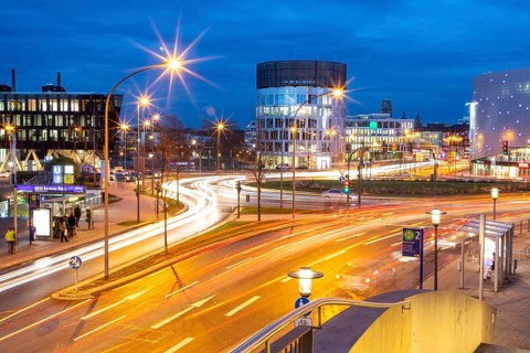 Evening city traffic in Essen, Germany, large intersection, roundabout, Berliner Platz, Berlin