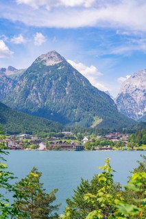 Turquoise-coloured lake in the mountains under a blue sky in summer, Achernsee, Austria, Germany