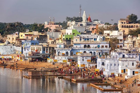 PUSHKAR, INDIA, NOVEMBER 20, 2012: Hindu devotees pilgrims bathing in sacred Puskhar lake (Sagar)