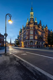 Speicherstadtrathaus in Speicherstadt with road traffic at the blue hour, Hamburg, Germany