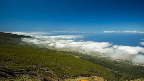 Panorama of the west coast with trade wind clouds from the Mirador El Valle viewpoint, Parque