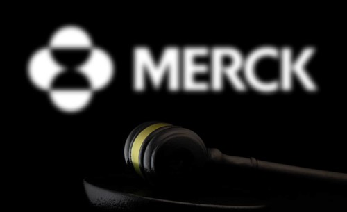 Court gavel in front of the Merck logo. Merck & Co Inc is an American multinational pharmaceutical