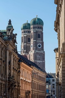Bell towers of the Gothic Church of Our Lady, Cathedral of Our Lady, neo-baroque bank building by