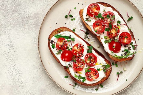 Sandwiches with cream cheese and cherry tomatoes, breakfast, homemade