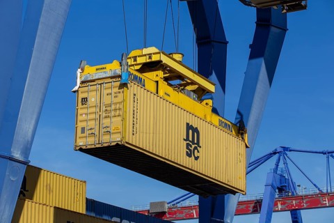 11 April 2024, Mannheim: A container from the Mediterranean Shipping Company (MSC) is loaded at the
