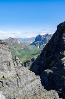 View between rocks at the summit of Innerdalstårnet on Innerdalen high valley, Trollheimen Mountain