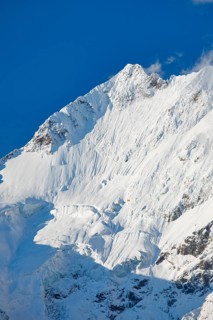 Freshly snow-covered summit of Piz Bernina and Biancograt, Engadin in the canton of Graubünden,