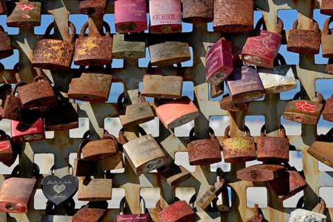 Lattice with rusty love locks, North Sea, Norddeich, Lower Saxony, Germany