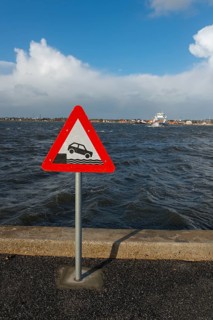 Sign warning of the danger of getting into the water, traffic sign at the ferry harbour, Egense,