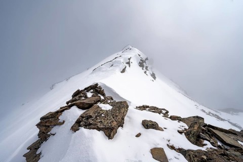 Cloudy summit Kesch Pitschen, ski tour Bündner Haute Route, Albula Alps, Rhaetian Alps, Grisons,