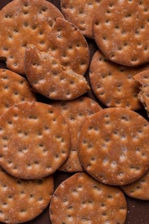 Crispbread, round, with salt and herbs, top view, food concept, no people