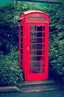 Vintage retro effect filtered hipster style travel image of red English telephone booth