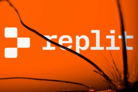 replit logo is visible on the broken glass. Replit is an American start-up and an online integrated