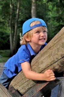Boy, 4 years old, climbs on playground equipment in Vejle, Jutland, Denmark, Scandinavia