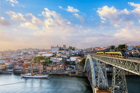 View of Porto city and Douro river and Dom Luis bridge I with tram from famous tourist viewpoint