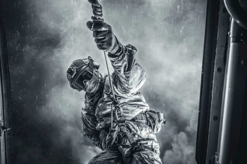 Soldier prepares to jump from a helicopter. The concept of computer games.