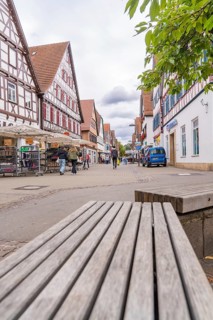 Town scene with half-timbered buildings and a busy shopping street, Kirchheim Teck, Germany