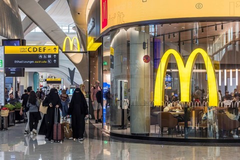 Abu Dhabi Airport, Zayed International Airport with passengers. McDonalds restaurant. The new