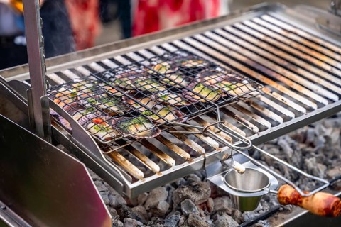 Fresh vegetables grilling on an outdoor barbecue, showcasing vibrant colors and delicious aromas,