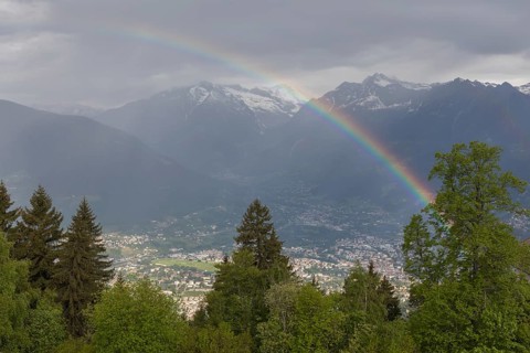 Church St. Kathrein, 39010 Hafling, Italy with a rainbow in the background