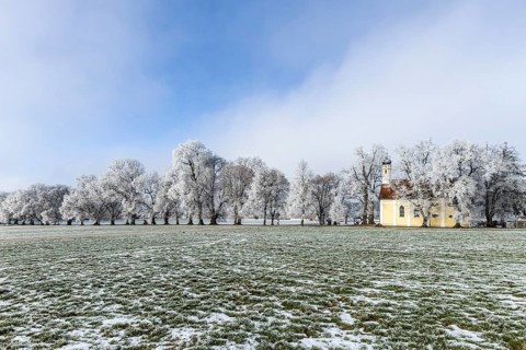 A frosty landscape with a small church in a wide field, Maria Schnee Chapel, Nassenbeuren,