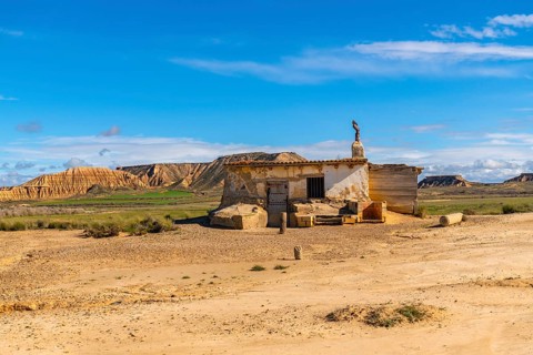 Old abandoned building standing in the arid landscape of the bardenas reales desert in navarre,