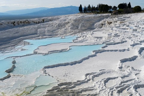 Pamukkale white limestone formations and turquoise water basins, sinter terraces, chalk sinter