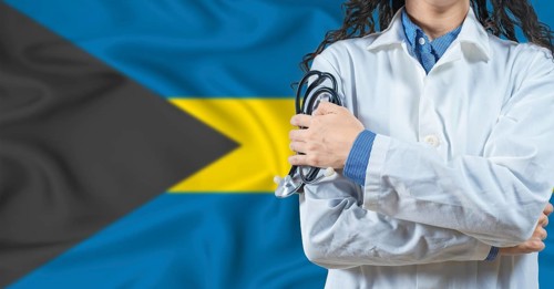 Healthcare professional with Bahamas flag background. Professional doctor holding stethoscope on
