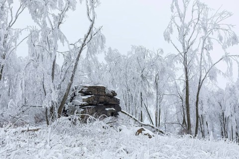 Rock formation with hoarfrost and snow on the summit of the Czorneboh, Lusatian Mountains, Upper