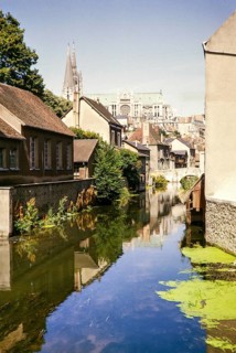 View of the river Eure and the cathedral church of Chartres, France 1964