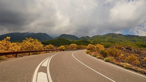 Road, curve, yellow bushes, clouds, mountains, Etna, volcano, eastern Sicily, Sicily, Italy