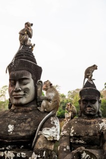 Figures and monkeys on the bridge to Angkor Thom, macaques, sunset, Angkor Wat, Angkor, UNESCO