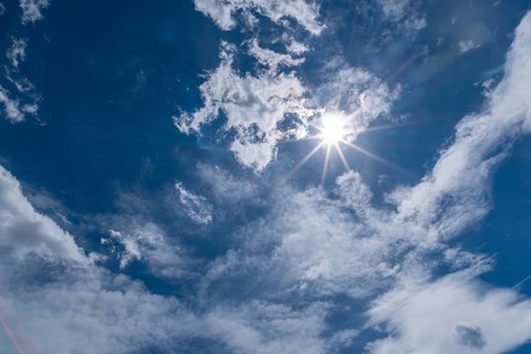Brilliant sun above clouds in the sky, Ternitz, Lower Austria, Austria