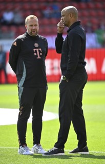 Coach Vincent Kompany FC Bayern Munich FCB in discussion with assistant coach Aaron Danks FC Bayern