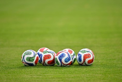 Adidas FIFA World Cup 2026 TRIONDA PRO balls lie on grass international soccer match, Germany, MEWA