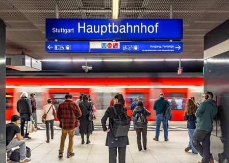 Subway platforms deep in the main train station with waiting passengers. Stuttgart,