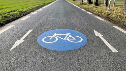 Large marking on narrow district road country road in rural area painted symbol for road signs 244