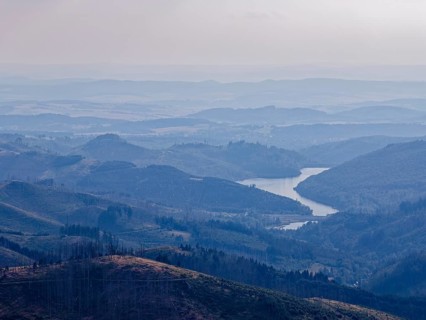 Mountain landscape in the Harz nature park Park, evening haze over the valleys, and in the