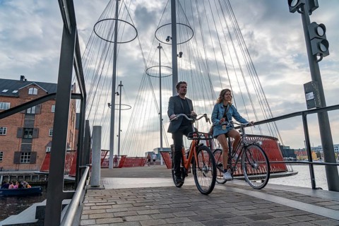 Cyclists on the Cirkelbroen cycle and pedestrian bridge, over the harbour, in the Christianshavens