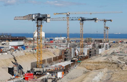 Construction cranes at the construction site of the Fehmarnbelt Tunnel, island of Fehmarn, 08.04