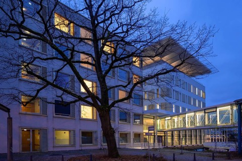 New construction of the University Hospital for Surgery with helicopter landing pad, dusk,