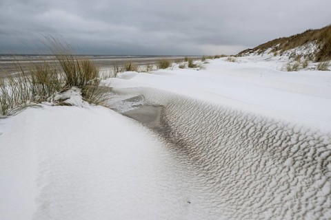 Snow-covered dunes on the North Sea beach, Langeoog, Lower Saxony, Germany