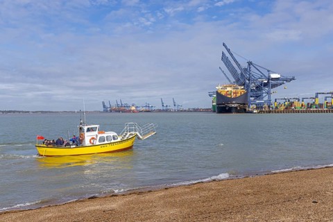 Harbour ferry departs, people, beach, container port, container ship, Felixstowe, England, Great