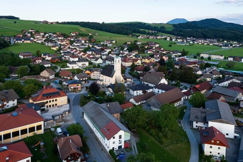 Drone shot, view of village with parish church, Rangersdorf, Mölltal, Carinthia, Austria