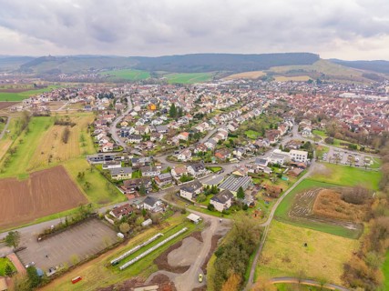 Bird's eye view of urban surroundings with residential buildings, streets and nature, Großbottwar,